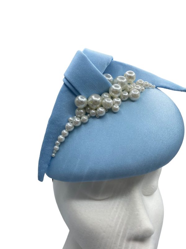Baby blue teardrop shaped headpiece with pearl detail.